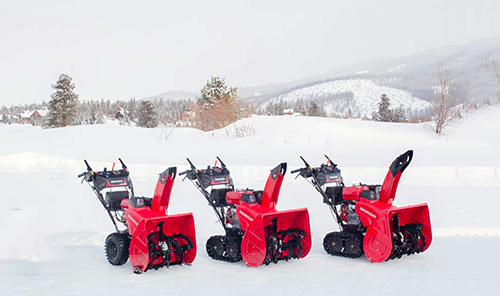 4 Honda Snow Blowers in the snow